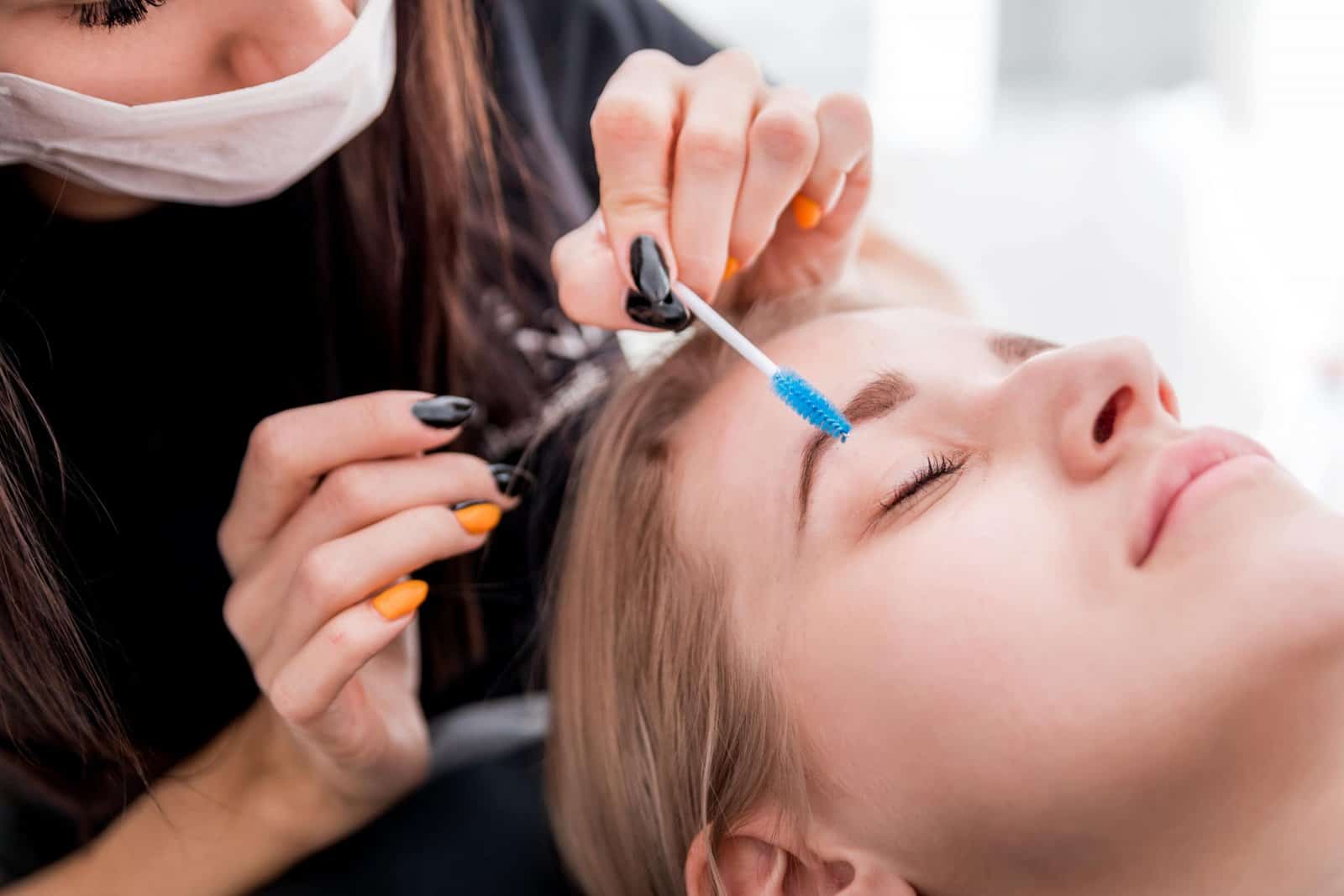 pretty girl getting brow depilation at beauty salo utc min scaled
